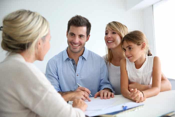 Picture of a young happy family taking advice property lettings advice from assured residential